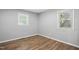 Neutral bedroom with hardwood floors and bright natural light at 5805 Farm Gate Rd, Raleigh, NC 27606