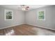 Bedroom featuring hardwood floors and bright natural light at 5805 Farm Gate Rd, Raleigh, NC 27606