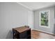 Cozy dining area featuring hardwood floors and natural light from a window at 5805 Farm Gate Rd, Raleigh, NC 27606
