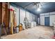 Spacious garage with blue trim, laundry area, and ample storage space at 5805 Farm Gate Rd, Raleigh, NC 27606