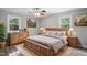 Inviting main bedroom with wood furnishings, ceiling fan, and neutral tones at 5805 Farm Gate Rd, Raleigh, NC 27606