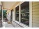 Welcoming front porch features a 'Welcome' mat, brick base, and view of the landscaped yard at 5805 Farm Gate Rd, Raleigh, NC 27606