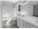 A bright white bathroom, offering a clean and classic design with a shower-tub combo and modern vanity at 6005 Antigua, Knightdale, NC 27545