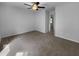 Neutral bedroom with ceiling fan, plush carpet, and ensuite bathroom access at 6005 Antigua, Knightdale, NC 27545