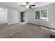 Bright living room with fresh carpet and large windows, perfect for furnishing and creating a cozy atmosphere at 6005 Antigua, Knightdale, NC 27545