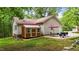 This backyard includes a shed, patio set with grill, and plenty of space to enjoy at 6204 Silver Spring Ct, Willow Springs, NC 27592