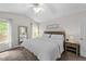 Serene bedroom with neutral tones, soft carpet, ceiling fan, and cozy furnishings at 6204 Silver Spring Ct, Willow Springs, NC 27592