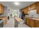 Modern kitchen with stainless steel appliances and mobile island open to dining area at 6204 Silver Spring Ct, Willow Springs, NC 27592