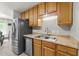 Spacious kitchen with stainless steel appliances, ample cabinet space and modern countertops at 6204 Silver Spring Ct, Willow Springs, NC 27592