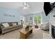 Bright living room features vaulted ceilings, neutral decor, and a cozy fireplace at 6204 Silver Spring Ct, Willow Springs, NC 27592