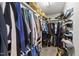 Spacious walk-in closet with extensive storage solutions, multiple shelves, and rods at 6204 Silver Spring Ct, Willow Springs, NC 27592