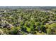 Aerial shot showcases houses interspersed among verdant trees, creating a serene, nature-filled neighborhood ambiance at 623 Oakgrove Dr, Graham, NC 27253