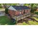 Inviting backyard deck offers ample seating and outdoor enjoyment for entertaining guests at 623 Oakgrove Dr, Graham, NC 27253