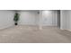 A spacious finished basement featuring neutral colored walls and carpet at 623 Oakgrove Dr, Graham, NC 27253