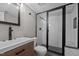 This bathroom offers a vanity and a new shower with herringbone tile at 623 Oakgrove Dr, Graham, NC 27253