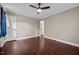 This bedroom offers hardwood floors and a ceiling fan at 623 Oakgrove Dr, Graham, NC 27253