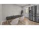 Bright dining room with stainless steel refrigerator and hardwood flooring at 623 Oakgrove Dr, Graham, NC 27253