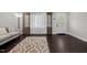 Inviting living room with dark hardwood floors and lots of natural light at 623 Oakgrove Dr, Graham, NC 27253