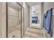 Bathroom with tiled shower and glass door, with a view into the bedroom at 628 Carolina Crossings Dr, Apex, NC 27523