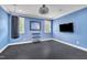 Exercise room with blue walls, rubber flooring, a punching bag and dumbbell rack at 628 Carolina Crossings Dr, Apex, NC 27523