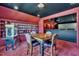 This game room features a wet bar, table, seating, and a popcorn machine at 628 Carolina Crossings Dr, Apex, NC 27523