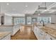 Spacious open kitchen with double islands, hardwood floors, and stainless steel appliances at 628 Carolina Crossings Dr, Apex, NC 27523
