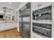 Stainless steel refrigerator and built in appliances in the open concept kitchen at 628 Carolina Crossings Dr, Apex, NC 27523