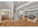 Spacious living area with hardwood floors, staircase, and open layout at 628 Carolina Crossings Dr, Apex, NC 27523