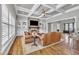 Living room area with coffered ceilings and a stone fireplace at 628 Carolina Crossings Dr, Apex, NC 27523