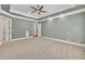 Large main bedroom has tray ceilings and multiple entry points to ensuite bathroom at 628 Carolina Crossings Dr, Apex, NC 27523