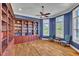 Home office with custom built-in shelving, crown molding and shuttered windows at 628 Carolina Crossings Dr, Apex, NC 27523