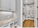 Office nook and storage cabinets with granite countertops right off the kitchen and pantry at 628 Carolina Crossings Dr, Apex, NC 27523