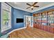 Home office features built-in shelving, crown molding and glass paneled french doors at 628 Carolina Crossings Dr, Apex, NC 27523