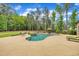 This home has a stunning backyard featuring a sparkling pool, cozy lounge chairs, and lush landscaping, perfect for relaxation at 628 Carolina Crossings Dr, Apex, NC 27523