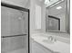 Bathroom featuring glass shower enclosure, vanity with sink, and modern fixtures at 701 Oakwood St, Mebane, NC 27302