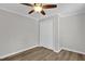 This bedroom features a closet, neutral walls and vinyl plank flooring at 701 Oakwood St, Mebane, NC 27302