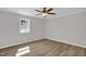 Cozy bedroom with grey paint, white trim, natural light, and vinyl plank flooring at 701 Oakwood St, Mebane, NC 27302
