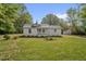 Charming single-story home with a well-manicured lawn and a cute front porch at 701 Oakwood St, Mebane, NC 27302