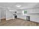 Modern kitchen with white cabinetry, stainless steel appliances, and stylish countertops at 701 Oakwood St, Mebane, NC 27302