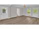 Open-concept living space with wood flooring and natural light, offering a welcoming ambiance at 701 Oakwood St, Mebane, NC 27302