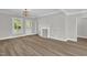 Elegant living room with fireplace, hardwood floors and neutral color, perfect to enjoy at 701 Oakwood St, Mebane, NC 27302