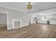 Open floor plan of living room and kitchen, showcasing modern finishes and ample natural light at 701 Oakwood St, Mebane, NC 27302