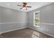 Bright bedroom with fresh paint, new floors, and a ceiling fan, offering a blend of comfort and style at 7030 Shep Royster Rd, Oxford, NC 27565