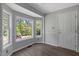 Bright breakfast nook with natural light streaming through large windows and new flooring at 7030 Shep Royster Rd, Oxford, NC 27565