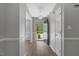 Inviting foyer with a modern light fixture, neutral wall color, and wood-look flooring, creating a bright entrance at 7030 Shep Royster Rd, Oxford, NC 27565