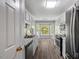 Bright kitchen features stainless steel appliances, granite countertops, and a bay window at 7030 Shep Royster Rd, Oxford, NC 27565