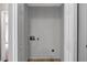 Empty laundry room, ready for a washer and dryer, with access to adjacent rooms at 7030 Shep Royster Rd, Oxford, NC 27565