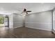 Open living room with new flooring, updated ceiling fan and neutral color scheme at 7030 Shep Royster Rd, Oxford, NC 27565