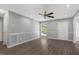 Living room with new floors, fresh paint, ceiling fan and tons of natural light at 7030 Shep Royster Rd, Oxford, NC 27565