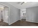 Main bedroom with new flooring, ceiling fan, and an en suite bathroom creating a relaxing retreat at 7030 Shep Royster Rd, Oxford, NC 27565